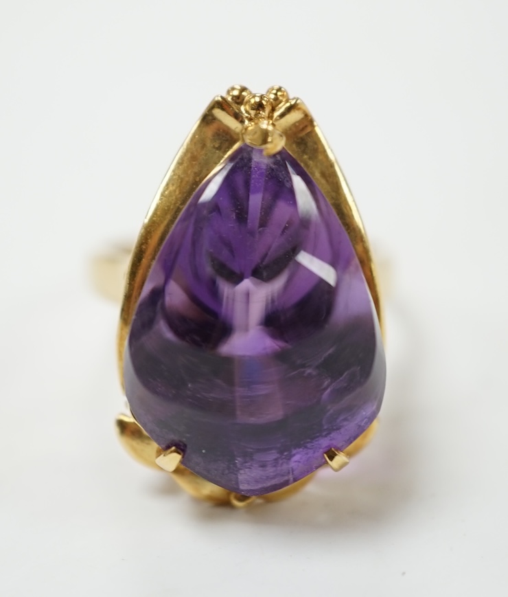 A modern 18k and singe stone fancy pear cut amethyst set dress ring, size L, gross weight 7.1 grams. Condition - good